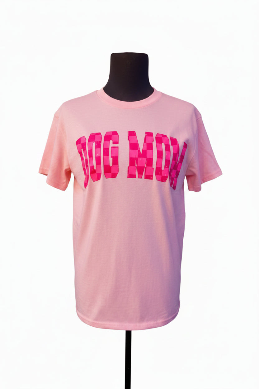 Light pink T-shirt with pink checkered text on a mannequin