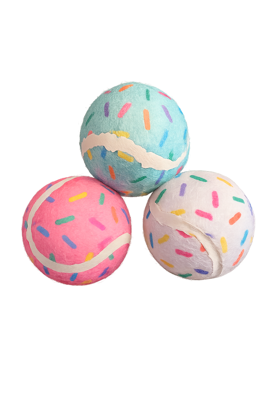 Three tennis balls with sprinkles, a blue ball, a pink ball, and a white ball.