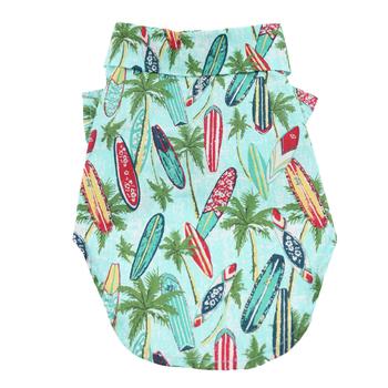 Dog tee with tropical pattern featuring surfboards and palm trees on a light blue background