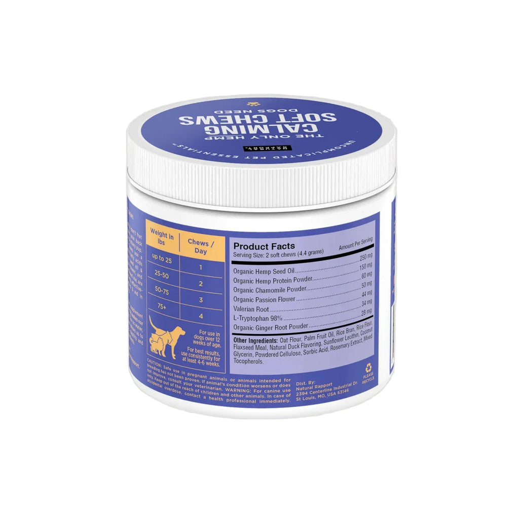 A white plastic tub of The Only Calming Soft Chews Dogs Need, featuring a blue label and lid, set against a solid light graywhite background.