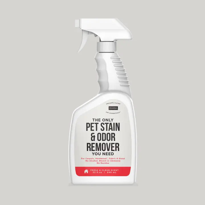 White spray bottle labeled 'Pet Stain & Odor Remover' 