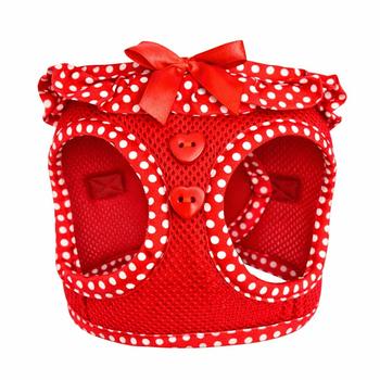 Red polka dot pet harness with a bow on a white background