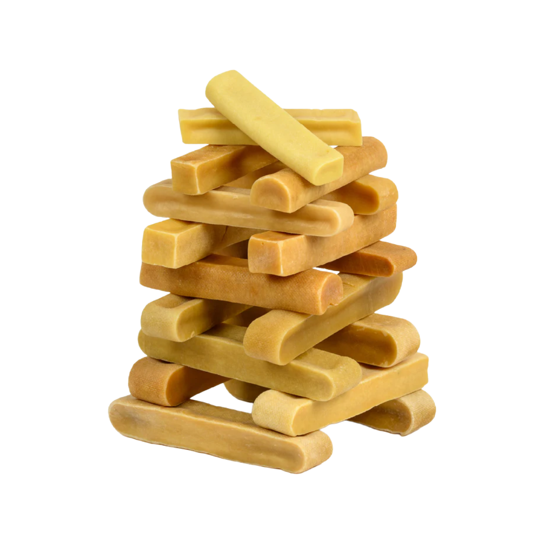 A stack of yellow yak cheeses