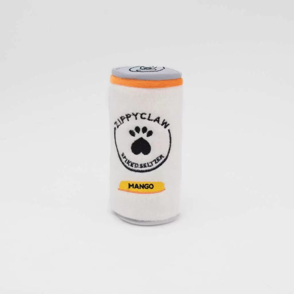 A white plush dog toy shaped like a canned soda, featuring a black paw print logo with the text 'ZIPPYCLAW' and 'SMOKED SALT TA' on the front, an orange band around the neck, and a yellow label reading 'MANGO'.