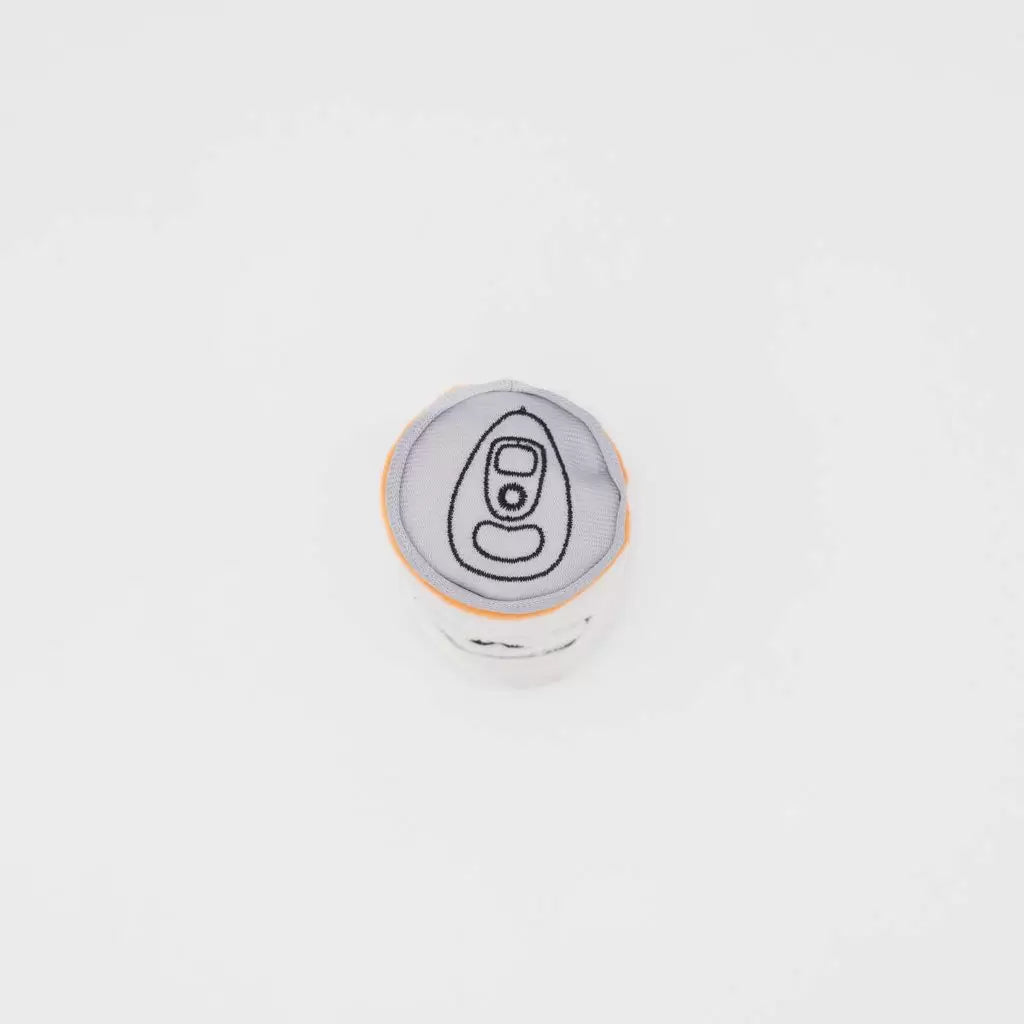 Round gray and white toy with a design on a light gray background