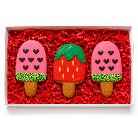 a gift box with 3 decorated pupsicles