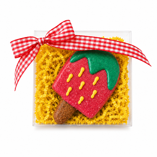 a gift box with one strawberry pupsicle and red gingham bow